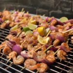 circa events prawns on the bbq with chermoula rub and red onions on the bbq