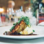 circa events main course pie and mash bistro menu served on a white plate with wedding in background