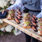 circa events mixed canapes on wooden board including proscuitto, salmon