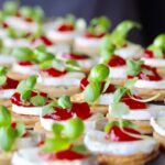 circa events mini canapes flat pastry with chilli jam and local goats cheese on a slate