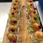 circa events prawn canape served in shot glasses with signature little heart skewers