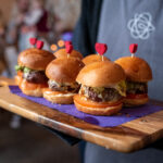 Circa events mini burger canapes served post dinner on wooden board with circa logo