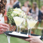 circa events cocktails on a tray margharita held by a member of staff