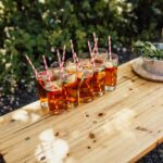 pimms on bench bar with straws and fresh fruit